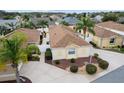 Aerial view of a house and surrounding neighborhood at 1521 Trenton Ln, The Villages, FL 32162