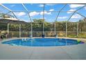 Inviting screened pool with ample deck space, perfect for relaxation at 1712 Palo Alto Ave, Lady Lake, FL 32159