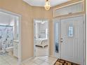 Bright entryway with view of bathroom and bedroom at 21509 Castle View Ct, Leesburg, FL 34748