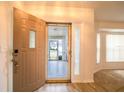 Interior view of entryway with access to front porch at 21721 Loch Haven Pass, Leesburg, FL 34748