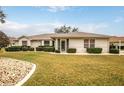 Single-story house with well-maintained lawn at 21721 Loch Haven Pass, Leesburg, FL 34748