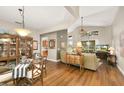 Elegant dining room featuring hardwood floors and a glass-top table at 2334 Fenton Ave, Clermont, FL 34711