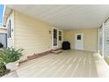 Covered patio with storage and grill area at 1007 Dustin Dr, The Villages, FL 32159