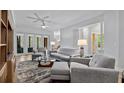 Spacious living room with light walls and comfortable seating at 102 Camino Real Blvd # 102, Howey In The Hills, FL 34737