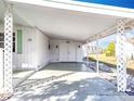 Covered carport with decorative lattice accents at 1026 Capella Dr, Tavares, FL 32778