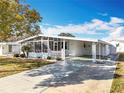 Clean exterior of a single-story home with a carport at 1026 Capella Dr, Tavares, FL 32778