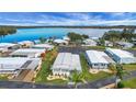 Community overview showing lakefront homes and landscaping at 16 Captains Pt, Fruitland Park, FL 34731