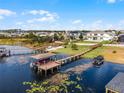 Aerial view of waterfront home with boat dock at 16428 Good Hearth Blvd, Clermont, FL 34711
