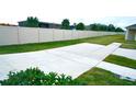 Large backyard with a concrete patio and a tall privacy fence at 2295 Delhi Pl, Sanford, FL 32771