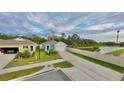 New single-story home features a two-car garage, an expansive driveway and a well-manicured front lawn at 2295 Delhi Pl, Sanford, FL 32771