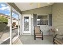 Relaxing screened porch with comfy seating, perfect for enjoying the Florida weather at 3347 Empire Ave, The Villages, FL 32163
