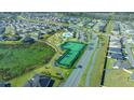 Aerial view showing tennis courts and community pathways at 4442 Shannon Loop, The Villages, FL 32163