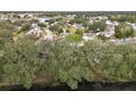 High-angle view of a residential area near a lake at 5505 Tangelo St, Leesburg, FL 34748