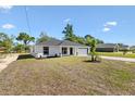 Beautiful single-story home featuring well-kept landscaping and a freshly paved driveway at 9139 Se 155Th Pl, Summerfield, FL 34491