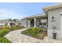 Landscaped walkway leading to the front entrance of a house at 9287 Sw 102Nd Avenue Rd, Ocala, FL 34481