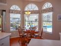 Bright breakfast nook overlooking the pool and patio at 10108 Silver Bluff Dr, Leesburg, FL 34788