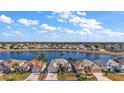 Stunning property overlooking a lake in a residential community at 2134 Zaragoza Pl, The Villages, FL 32159