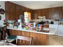 Kitchen with wood cabinets and an island at 225 N West St, Bushnell, FL 33513