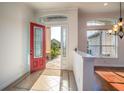 Open entryway with red door and view to backyard at 2441 Bar Harbor Bay, Mount Dora, FL 32757