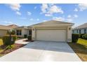 Single story house with attached garage and walkway leading to the entrance at 3488 Sterling St, The Villages, FL 32162