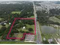 Aerial view showing property boundaries and surrounding environment at 3704 Warm Springs Ave, Wildwood, FL 34785