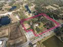 Aerial view showcasing property location and surrounding landscape at 3704 Warm Springs Ave, Wildwood, FL 34785