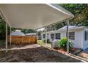 Covered carport with additional storage shed in backyard at 4110 Close Ct, Mount Dora, FL 32757