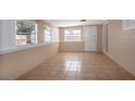 Bright sunroom with tile flooring and neutral colored walls at 4110 Close Ct, Mount Dora, FL 32757