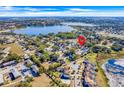 Aerial view showing house location near a lake and other homes at 415 Renee Dr, Haines City, FL 33844