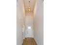 Bright and airy entryway with high ceilings and wood flooring at 5155 Firebush Dr, Apopka, FL 32712