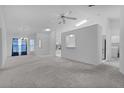 Bright and airy living room with a view into the kitchen at 5530 Tangelo St, Leesburg, FL 34748