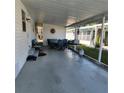 Covered patio with seating area, great for outdoor dining at 7 Cocos Plumosa Dr # A, Eustis, FL 32726