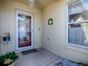 Inviting front entry with glass door and decor at 8480 Se 167Th Forsyth St, The Villages, FL 32162