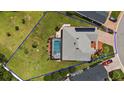 Bird's-eye view of house, pool, and large backyard at 10377 Silver Maple Ave, Oxford, FL 34484