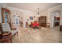 Elegant dining room with tiled floors and antique furniture at 11189 Roz Way, Oxford, FL 34484