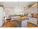 Spacious kitchen featuring granite countertops and white cabinets at 1276 Bennett Pl, The Villages, FL 32162