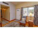 Cozy front entryway with rocking chair and hardwood floors at 1420 Anderson St, Clermont, FL 34711