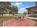 Relaxing patio overlooking a lake, perfect for outdoor entertaining at 16029 Worthington N Blvd, Mascotte, FL 34753