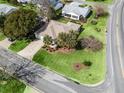 House nestled in a residential community with tree-lined streets at 2001 Cordero Ct, The Villages, FL 32159