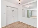 Bright entryway with double doors and a large mirror at 2010 Hollywood Dr, Leesburg, FL 34748