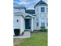 Green front door with a brick pathway leading to the entrance at 2185 Victoria Dr, Davenport, FL 33837