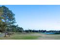 Scenic view of the golf course and water feature from the property at 2202 Margarita Dr, The Villages, FL 32159