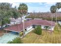 Aerial view of single-story home with carport and large backyard at 28228 Tammi Dr, Tavares, FL 32778