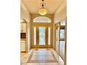 Bright and spacious entryway with tile flooring and natural light at 33304 Kaylee Way, Leesburg, FL 34788