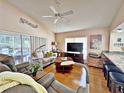 Relaxing living room with hardwood floors and access to a patio at 3570 Rollingbrook St, Clermont, FL 34711