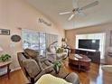 Living room with hardwood floors and patio access at 3570 Rollingbrook St, Clermont, FL 34711