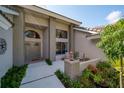 Inviting front entry with brick columns, double doors, and a cozy sitting area at 365 N Spaulding Cv, Lake Mary, FL 32746