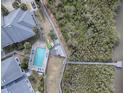 Aerial view of a community pool, boardwalk, and kayaks at 4870 S. Atlantic Ave, # 2040, New Smyrna Beach, FL 32169