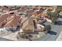 Aerial view of a single-story home with a well-kept yard, close to ample parking at 878 Oviedo Rd, The Villages, FL 32159