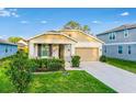 Charming single-Gathering home with a well-manicured lawn and a welcoming front porch at 10161 Spring Lake Dr, Clermont, FL 34711